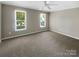 Simple bedroom with large windows allowing for natural light at 1507 Chadmore Nw Ln, Concord, NC 28027