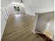 Spacious bonus room featuring new flooring, ceiling fan, and plenty of natural light at 1507 Chadmore Nw Ln, Concord, NC 28027