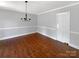 Dining room showcasing hardwood floors, modern lighting, and fresh paint at 1507 Chadmore Nw Ln, Concord, NC 28027