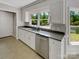 Charming kitchen with granite countertops, stainless steel appliances, and natural light from the large window at 1507 Chadmore Nw Ln, Concord, NC 28027