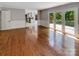 Bright living room with hardwood floors and French doors leading to a deck at 1507 Chadmore Nw Ln, Concord, NC 28027