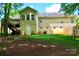 Exterior rear view of a charming home featuring a backyard, access to a deck, and a walkout basement at 1657 6Th Se St, Hickory, NC 28602