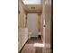 Bright bathroom featuring a shower-tub combination, a white vanity, and wood-look flooring at 1657 6Th Se St, Hickory, NC 28602