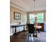 Breakfast nook with natural lighting, wood laminate flooring, and classic chandelier at 1657 6Th Se St, Hickory, NC 28602