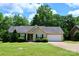 Charming single-story home with well-maintained lawn, mature trees, and attached two-car garage at 1657 6Th Se St, Hickory, NC 28602