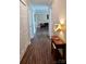 Hallway featuring wood laminate flooring and access to bedrooms and living spaces at 1657 6Th Se St, Hickory, NC 28602