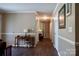 Hallway showcasing the wood laminate flooring, neutral paint, and crown molding at 1657 6Th Se St, Hickory, NC 28602
