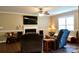 Comfortable living room with a fireplace, large TV, ceiling fan and plenty of space for seating at 1657 6Th Se St, Hickory, NC 28602