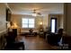 Inviting living room with a cozy fireplace, neutral tones, and comfortable seating for relaxation at 1657 6Th Se St, Hickory, NC 28602
