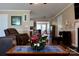 Open-concept living room with hardwood floors and views to the breakfast nook and kitchen at 1657 6Th Se St, Hickory, NC 28602
