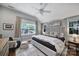 Bright bedroom with a vaulted ceiling, ceiling fan, and decorative pillows on the bed at 1713 Allen St, Charlotte, NC 28205