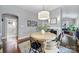 Charming dining room featuring a modern chandelier, hardwood floors, and a fireplace at 1713 Allen St, Charlotte, NC 28205