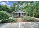 Charming home with inviting front porch, well-maintained landscaping, and a brick pathway leading to the entrance at 1713 Allen St, Charlotte, NC 28205