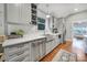 Well-lit kitchen with white countertops, stainless steel appliances, and hardwood flooring at 1713 Allen St, Charlotte, NC 28205