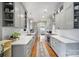Bright kitchen features stainless steel appliances, generous white countertops, and sleek gray cabinets at 1713 Allen St, Charlotte, NC 28205