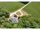 An aerial view of a beautiful property with sprawling green fields, mature trees, and a private driveway at 1720 Mills Harris Rd, Wingate, NC 28174