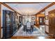 Formal dining room featuring hardwood floors, coffered ceilings, and ample seating at 1720 Mills Harris Rd, Wingate, NC 28174