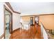 Second floor foyer featuring hardwood floors, curved staircase, and elegant chandelier at 1720 Mills Harris Rd, Wingate, NC 28174