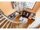 Foyer with curved staircase, hardwood floors, elegant chandelier, and grand entry doors at 1720 Mills Harris Rd, Wingate, NC 28174