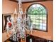Foyer with hardwood floors, chandelier, grand arched window, and decorative art at 1720 Mills Harris Rd, Wingate, NC 28174