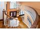 Foyer featuring hardwood floors, curved staircase, chandelier, and double entry doors at 1720 Mills Harris Rd, Wingate, NC 28174