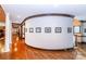 Hallway with hardwood floors, art, and columns at 1720 Mills Harris Rd, Wingate, NC 28174