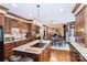 Large kitchen with granite island, custom wood cabinets and stainless steel appliances, perfect for entertaining at 1720 Mills Harris Rd, Wingate, NC 28174