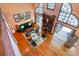 From above the living room shows dark wood trim, hardwood floors, and fireplace at 1720 Mills Harris Rd, Wingate, NC 28174