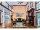 Spacious living room boasting soaring ceilings, fireplace, and floor-to-ceiling windows at 1720 Mills Harris Rd, Wingate, NC 28174