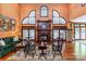 Bright living room with a fireplace, french doors, and hardwood flooring at 1720 Mills Harris Rd, Wingate, NC 28174