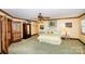Spacious main bedroom with carpet floors, fan, and ensuite bathroom access at 1720 Mills Harris Rd, Wingate, NC 28174