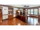 Office with hardwood floors, custom woodwork, built-in bookcases, and ceiling fan at 1720 Mills Harris Rd, Wingate, NC 28174