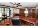 Inviting office features hardwood floors, custom millwork, built-in desk, and ample storage, creating a professional workspace at 1720 Mills Harris Rd, Wingate, NC 28174