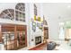 Bright sunroom featuring a fireplace and large windows for natural light at 1720 Mills Harris Rd, Wingate, NC 28174