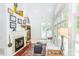 Bright sunroom featuring a fireplace and large windows for natural light at 1720 Mills Harris Rd, Wingate, NC 28174