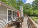 Outdoor deck featuring stylish furniture, ideal for entertaining with serene backyard views at 17501 Youngblood Rd, Charlotte, NC 28278