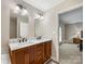 Spacious bathroom with double sink vanity and ensuite access at 17501 Youngblood Rd, Charlotte, NC 28278