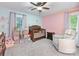 This charming bedroom features a crib, comfortable chair, and colorful decorations at 17501 Youngblood Rd, Charlotte, NC 28278