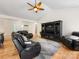 Spacious living room with ceiling fan, hardwood floors, and ample seating at 17501 Youngblood Rd, Charlotte, NC 28278