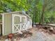 A backyard storage shed with double doors provides secure outdoor storage and workspace at 17501 Youngblood Rd, Charlotte, NC 28278