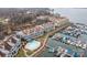 Aerial view of waterfront community with marina and swimming pool at 18669 Vineyard Point Ln, Cornelius, NC 28031