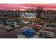 Stunning aerial view of waterfront condos and marina with colorful boats at 18669 Vineyard Point Ln, Cornelius, NC 28031