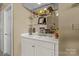 Charming bar area with white cabinets and decorative shelving at 18669 Vineyard Point Ln, Cornelius, NC 28031