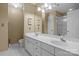 Spacious bathroom featuring double sinks, white cabinetry, and walk-in shower at 18669 Vineyard Point Ln, Cornelius, NC 28031