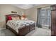Inviting bedroom with warm tones, comfortable bed, and natural light at 18669 Vineyard Point Ln, Cornelius, NC 28031