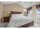 Comfortable bedroom with plush carpeting, vaulted ceiling, and large window at 18669 Vineyard Point Ln, Cornelius, NC 28031