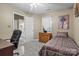 Cozy bedroom with neutral walls, comfortable bed, and bright window at 18669 Vineyard Point Ln, Cornelius, NC 28031