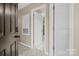 Hallway features multiple doors and neutral wall paint at 18669 Vineyard Point Ln, Cornelius, NC 28031