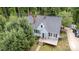 Aerial view of home showcasing well-maintained landscaping, a deck, and a convenient parking area at 200 Cleveland Ave, Shelby, NC 28150