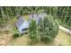 Aerial view of the home with a large yard, mature trees, and a winding driveway at 200 Cleveland Ave, Shelby, NC 28150
